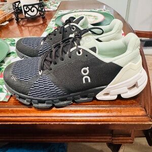 On Running Black and Cream Athletic Shoes